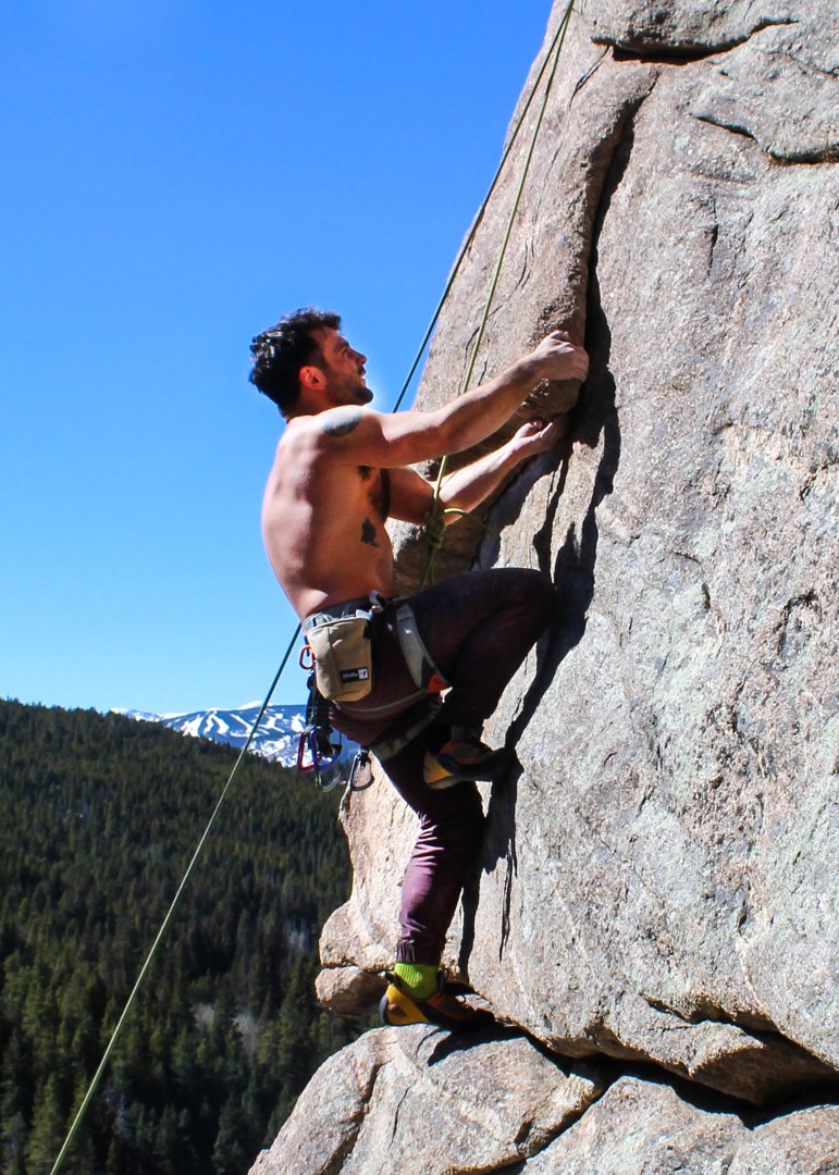 Photograph of one person climbing the mountain