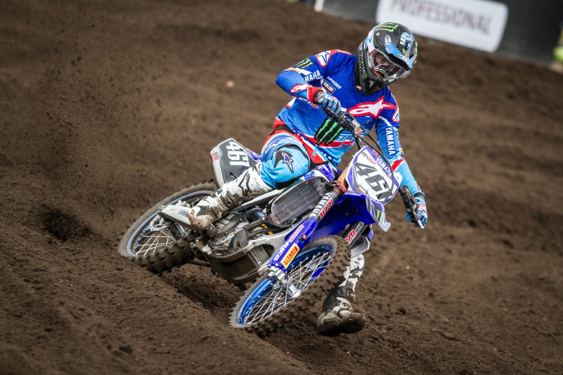 Photograph of one person riding a motorbike